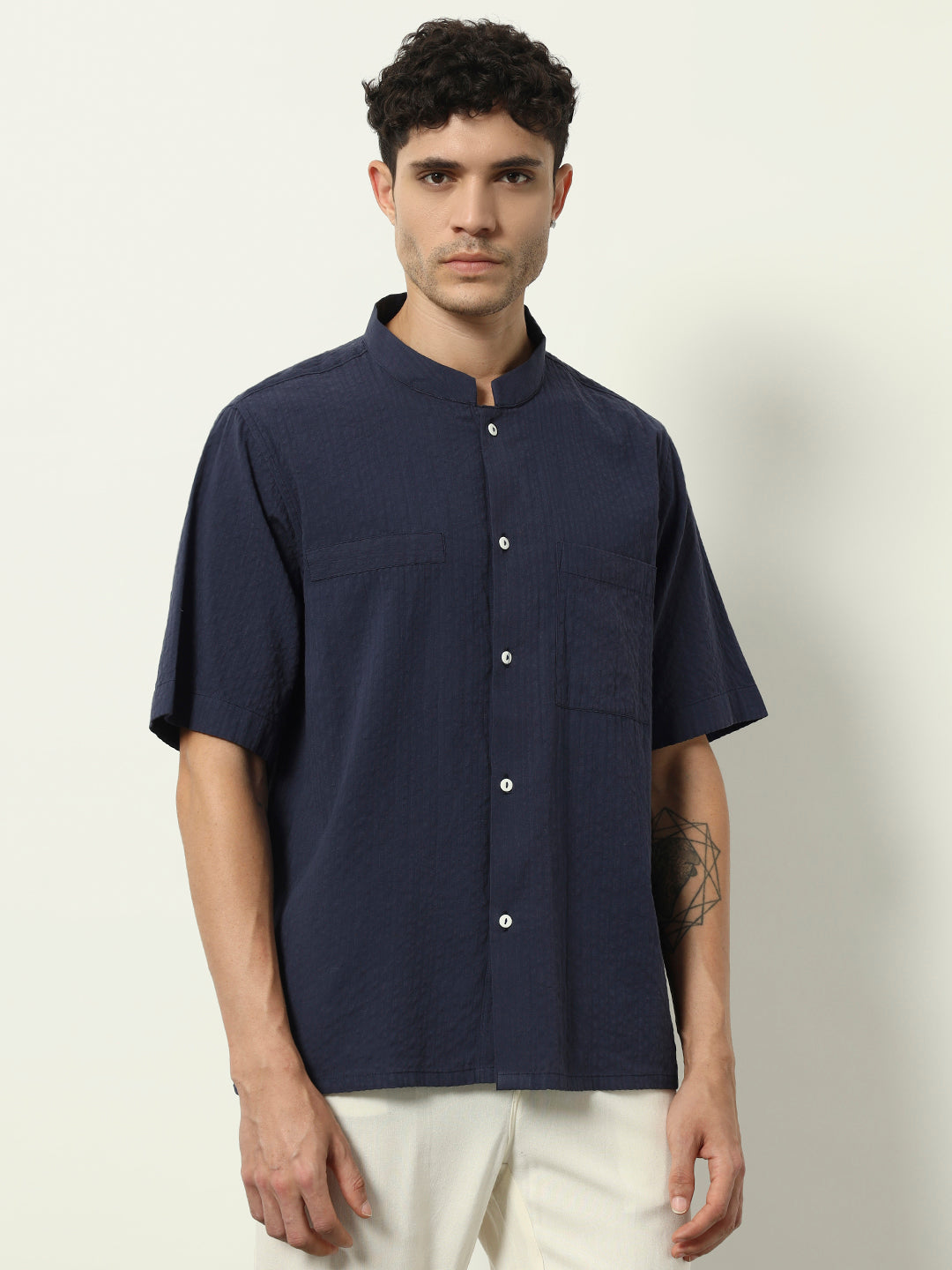Modern Minimal: Structured Navy Shirt with Statement Simplicity"