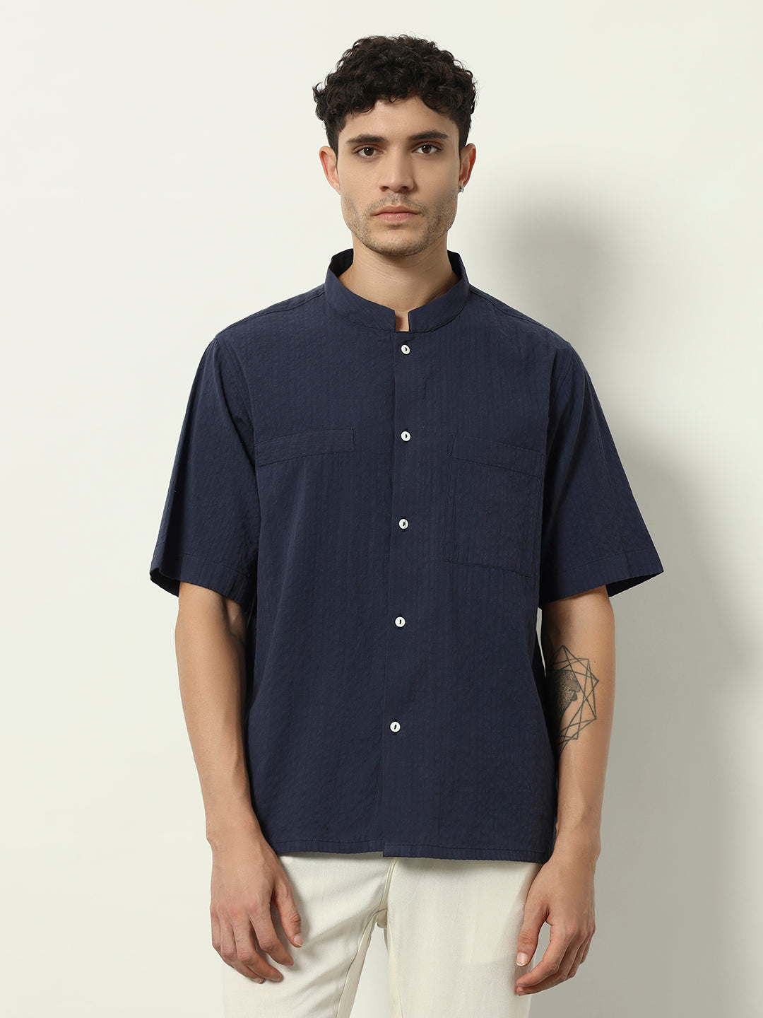 Modern Minimal: Structured Navy Shirt with Statement Simplicity"